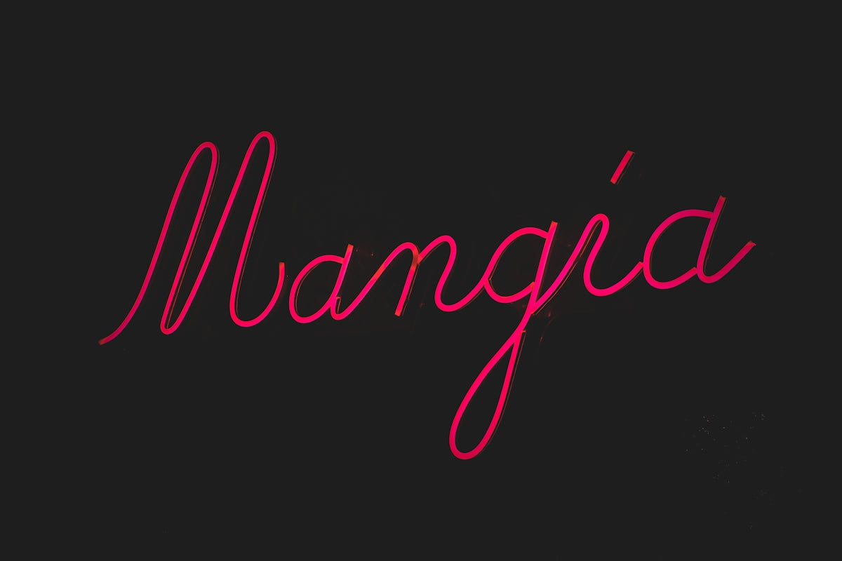a red neon sign that reads mangoa on a black background